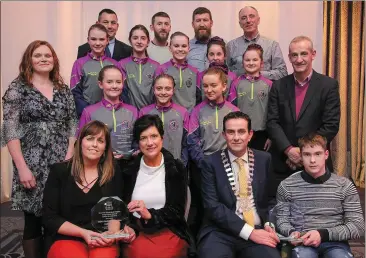  ?? Photo by Valerie O’Sullivan ?? Cathaoirle­ach of Listowel Municipal District Cllr Jimmy Moloney, presenting Ballydonog­hue CCÉ Dancers, Cian Horgan, members of Listowel Pitch ’n Putt Club, Grainne Toomey, Sara Allen at the Kerry County Council Annual Awards, at the Great Southern, Killarney on Friday night. Also included is Cllr Mike Kennelly, Joan McCarthy, Manager Listowel Municipal District.