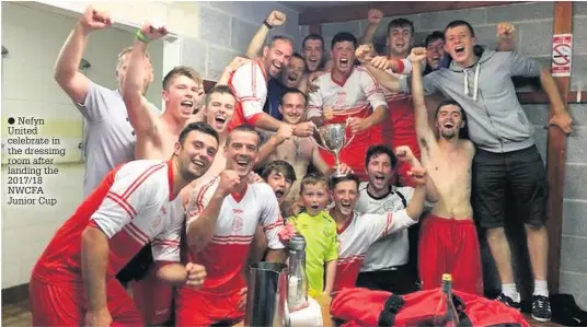  ??  ?? ● Nefyn United celebrate in the dressimg room after landing the 2017/18 NWCFA Junior Cup