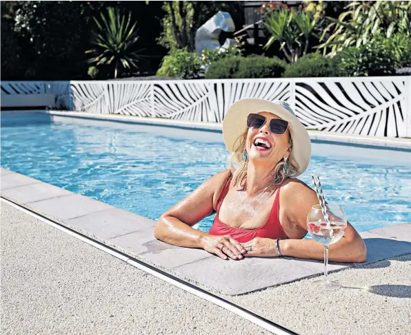  ?? ?? Summer living: despite the cost, Gloria Morris says she doesn’t regret her pool as the family enjoy it every day