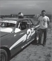  ?? Luke Wassom ?? Luke Wassom with a picture of his car from a season ago.