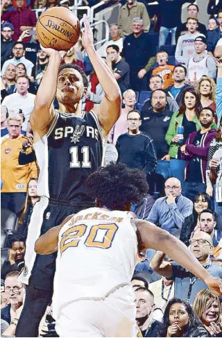  ?? AFP ?? Bryn Forbes of the San Antonio Spurs shoots a 3-pointer against the Phoenix Suns at Talking Stick Resort Arena in Phoenix, Arizona.