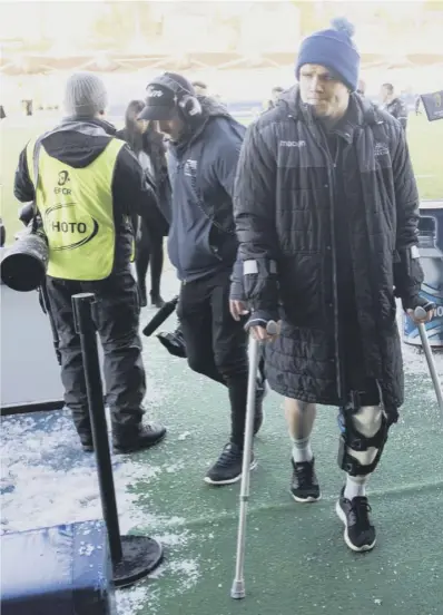  ??  ?? 0 Glasgow and Scotland hooker George Turner walks off on crutches at full-time at Scotstoun after sustaining a knee ligament injury in Saturday’s European Champions Cup victory over Exeter.