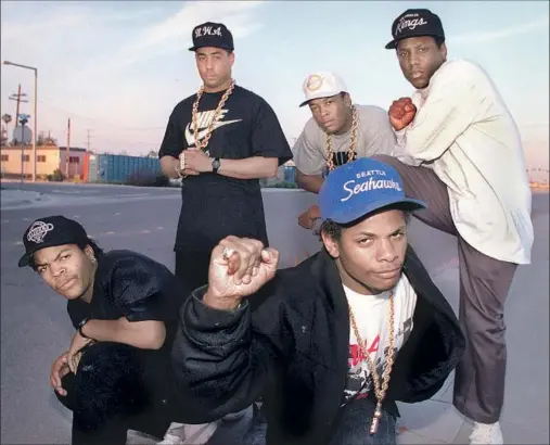  ?? Douglas R. Burrows Los Angeles Times ?? WHEN N.W.A landed on the scene in 1986, hip-hop was forever changed. Ice Cube, from left, and Eazy-E. Standing from left, DJ Yella, Dr. Dre and MC Ren.