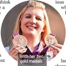  ?? ?? With her two gold medals