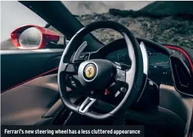  ??  ?? Ferrari’s new steering wheel has a less cluttered appearance