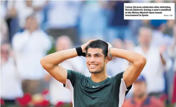  ?? Photo / AP ?? Carlos Alcaraz celebrates after defeating Novak Djokovic during a men’s semifinal at the Mutua Madrid Open tennis tournament in Spain.