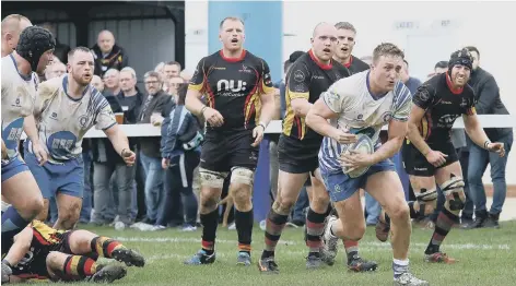  ?? PICTURES: MICK SUTTERBY ?? Try-scorer Tom Gulland on the attack for the Lions against Birmingham.