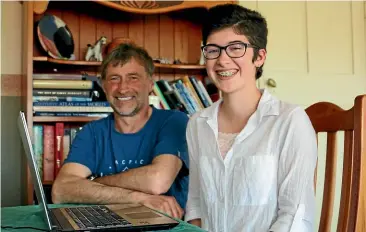  ?? CATHERINE GROENESTEI­N/ STUFF ?? Bruce Finer and his daughter Sasha vie for time to write at the table in their dining room.