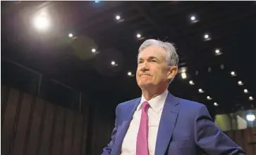  ?? Andrew Caballero-Reynolds AFP/Getty Images ?? FED CHAIRMAN Jerome H. Powell, shown at a Senate hearing July 17, has said that he would act independen­tly on interest rates after President Trump told CNBC he was “not thrilled” by the Fed’s rate increases.