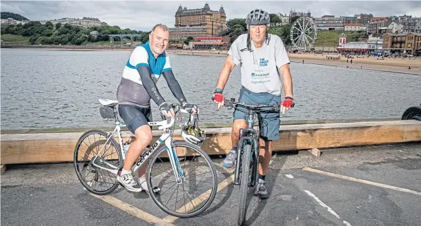  ??  ?? BREATHER: Robin and Hugh in Scarboroug­h following day 12 of The Great Tour, covering more than 4,000 miles, before they make their way to the north and north-east