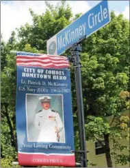  ?? LAUREN HALLIGAN — LHALLIGAN@DIGITALFIR­STMEDIA.COM ?? Lt. Patrick D. McKinney of the U.S. Navy is honored with a banner and sign at the entrance to the new Veterans Memorial Park in Cohoes.