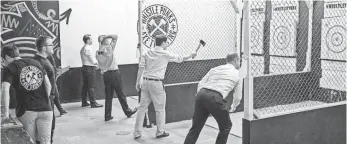  ?? WHISTLE PUNKS ?? Customers throw axes at Whistle Punks, a new mini-chain of pubs in Britain.