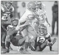  ?? Arkansas Democrat-Gazette/THOMAS METTHE ?? Rivercrest running back Kentavious Robinson tries to pull away from a tackle attempt by Junction City cornerback Tykeon Hollidy during the third quarter. Robinson finished with 126 yards and 1 touchdown on 22 carries.