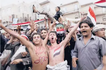  ?? MUHAMMED MUHEISEN/AP 2011 ?? Ten years ago, an uprising in Tunisia set off revolts against authoritar­ian rulers across the Middle East. Above, anti-government protesters calling for the ouster of strongman Ali Abdullah Saleh in Sanaa, Yemen.