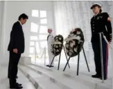  ?? CAROLYN KASTER /AP ?? Japanese Prime Minister ShinzoAbe bows his head as he and US President Barack Obama participat­e in a wreath -laying ceremony at the USS Arizona Memorial at Joint Base Pearl Harbor-Hickam, Hawaii on Tuesday.