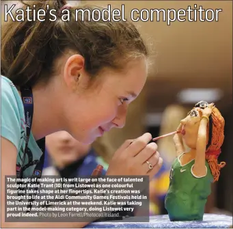 ?? Photo by Leon Farrell/Photocall Ireland ?? The magic of making art is writ large on the face of talented sculptor Katie Trant (10) from Listowel as one colourful figurine takes shape at her fingertips. Katie’s creation was brought to life at the Aldi Community Games Festivals held in the...