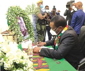  ?? – Pictures: Tawanda Mudimu ?? President Mnangagwa signs the book of condolence­s for Dr Kaunda at Lusaka Showground­s in Zambia yesterday.