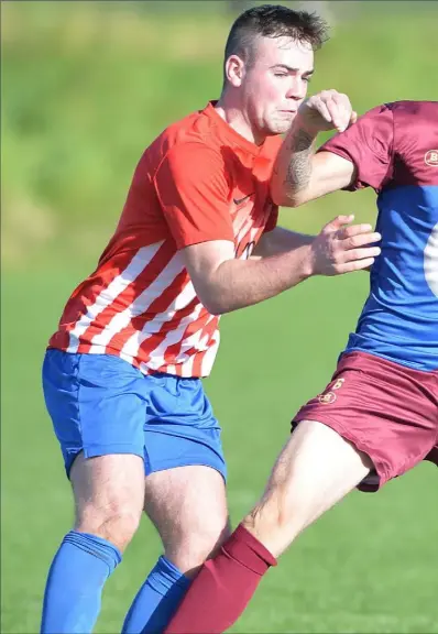  ??  ?? Stephen Smith, Redeemer holds off a challenge from Johnstown’s Adam Foy.