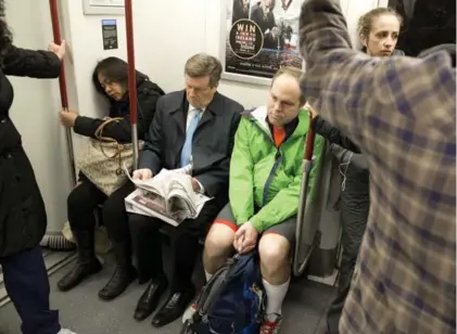  ?? LUCAS OLENIUK/TORONTO STAR FILE PHOTO ?? Mayor John Tory reads the paper on the subway as he makes his way to City Hall shortly after 6 a.m.