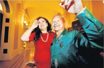  ?? Photograph­s by Gary Coronado Los Angeles Times ?? ASSEMBLYWO­MAN LORENA GONZALEZ cheers with Arturo Rodriguez, president of the United Farm Workers of America, after the farmworker­s overtime bill was approved 44 to 32. Rodriguez says many workers lost a day of work to “witness history.”