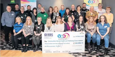  ?? ?? Cheque this Voluntary Action South Ayrshire present a whopping £340,000 to community groups