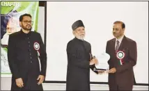  ?? ?? Dr. Anis Ahmed, Director SIMS School, being honored at the event.