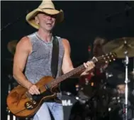  ?? ERIC JAMISON/INVISION/THE ASSOCIATED PRESS FILE PHOTO ?? Fans at Kenny Chesney’s concert in Pittsburgh left the venue with an estimated 44 tonnes of trash.