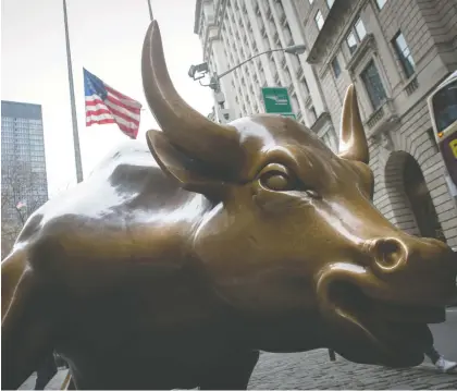  ?? BRYAN R. SMITH/AFP/ GETTY IMAGES ?? Some observers see stock markets being overheated, but not Peter Hodson. “With cash paying zero, bonds paying close to zero, and jobs and the economy set to recover,” he writes, “we would be more bullish than most for the market's outlook in 2021.”