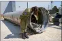  ?? PHOTO: AP ?? First lieutenant Masha Michelson, deputy head of the Israel Defense Force’s internatio­nal press department, shows the media the Iranian ballistic missiles Israel intercepte­d over the weekend, in Julis army base, Israel, yesterday.