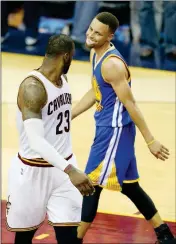  ?? ASSOCIATED PRESS ?? IN THIS JUNE 16, 2016, FILE PHOTO, Cleveland Cavaliers forward LeBron James (23) and Golden State Warriors guard Stephen Curry (30) look at each other during the second half of Game 6 of the NBA Finals in Cleveland.