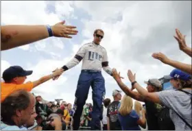  ?? PAUL SANCYA — THE ASSOCIATED PRESS ?? Brad Keselowski greets fans before the NASCAR Cup Series auto race in Brooklyn, Mich., Sunday.