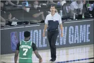  ?? ASHLEY LANDIS — THE ASSOCIATED PRESS ?? iBoston Celtics head coach Brad Stevens looks toward Jaylen Brown (7) during the first half of an NBA basketball game against the Milwaukee Bucks Friday, July 31, 2020, in Lake Buena Vista, Fla.