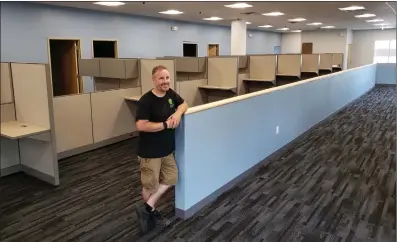  ?? Photos by Joseph B. Nadeau ?? John Fortier, the owner of Integral Real Estate Solutions, stands inside the nearly-completed Woonsocket branch of the Department of Motor Vehicles. Fortier’s company has been working on renovating the interior of the building, which was formerly a McDonald’s restaurant.