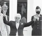  ?? JEFF ROBERSON/AP ?? Trainer Bob Baffert holds the trophy after Authentic captured the Kentucky Derby.