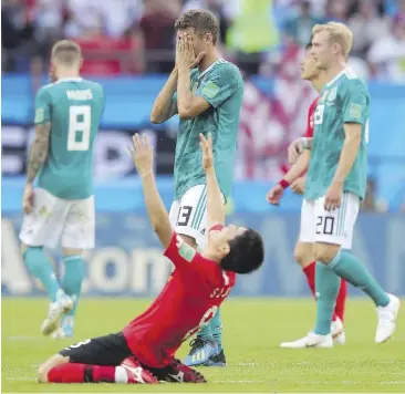  ?? GETTY IMAGES ?? South Korea’s Ju Se-jong is overcome with joy at the ref’s final whistle as the Koreans shocked defending world champion Germany Wednesday at the World Cup.