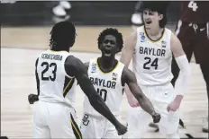 ?? MICHAEL CONROY/AP ?? BAYLOR GUARD ADAM FLAGLER (10), Jonathan Tchamwa Tchatchoua (23) and Matthew Mayer (24) celebrate a play against Arkansas during the second half of an Elite 8 game in the NCAA men’s tournament at Lucas Oil Stadium on Monday in Indianapol­is.