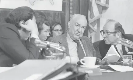  ?? Associated Press ?? SENATE Watergate Investigat­ing Committee Chairman Sen. Sam Ervin, center, listens to other committee members during the first day of public hearings in Washington in 1973. Daily coverage of the hearings rotated between ABC, CBS and NBC that year.