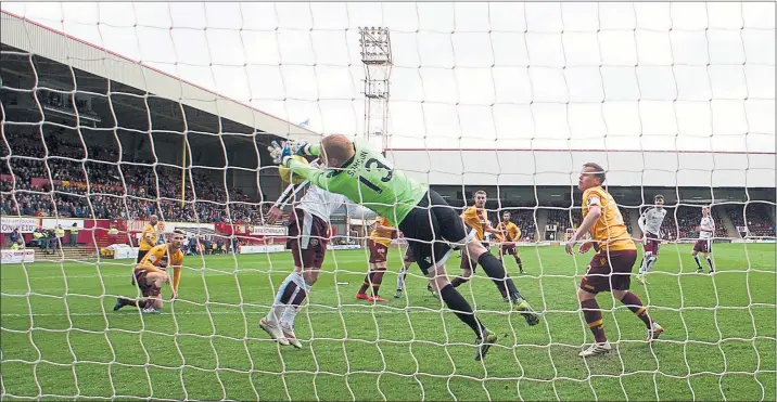  ?? Picture: SNS ?? SAVE: Craig Samson denied Juanma Delgado on this occasion but Motherwell were good value for the three points against Hearts.