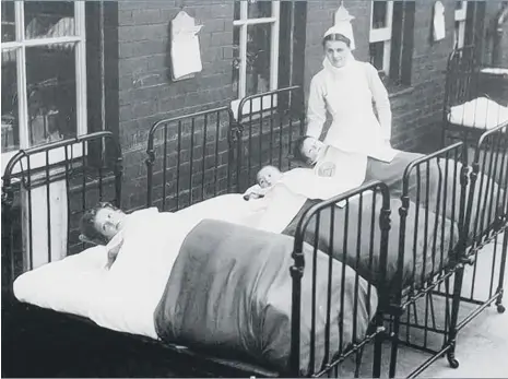  ??  ?? Young patients getting fresh air outside of the children’s hospital.