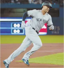  ?? AP PHOTO ?? POWER TRIP: Giancarlo Stanton rounds the bases after hitting a two-run home run during first-inning of the Yankees’ game against the Jays yesterday.
