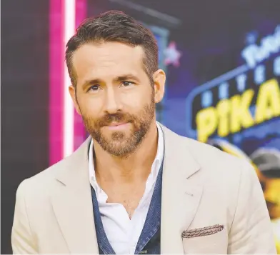  ?? ANGELA WEISS / AFP / GETTY IMAGES ?? Canadian actor Ryan Reynolds says the cape of the archetypal leading man never quite fit him. “But I also think our idea of a traditiona­l, leading man, archetypal make is changing wildly day to day,” he says.