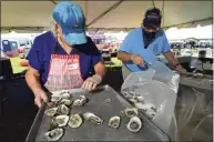  ?? Erik Trautmann / Hearst Connecticu­t Media ?? The Norwalk Oyster Festival drew throngs in mid-September as summer drew to a close, with many leisure employers having seen a boost in business as people sought diversions during the COVID-19 pandemic.