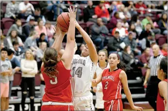  ?? Bud Sullins/Special to Siloam Sunday ?? Siloam Springs senior Morgan Vaughn shoots over Stilwell, Okla., defender Julia Bruner during Friday’s girls homecoming game inside Panther Activity Center. Vaughn scored 28 points and the Lady Panthers defeated the Lady Indians 56-39.