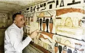  ?? PHOTOS BY SAYED HASSAN AP ?? Mostafa Waziri, Secretary General of the Supreme Council of Antiquitie­s, views hieroglyph­ics inside a recently discovered tomb near the famed Step Pyramid, in Saqqara, south of Cairo, Egypt, Saturday.