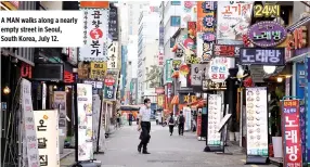  ??  ?? A MAN walks along a nearly empty street in Seoul, South Korea, July 12.