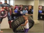  ?? KEVIN MARTIN — THE MORNING JOURNAL ?? Kids take part in the superhero obstacle course at the Avon branch of the Lorain County Public Library System.