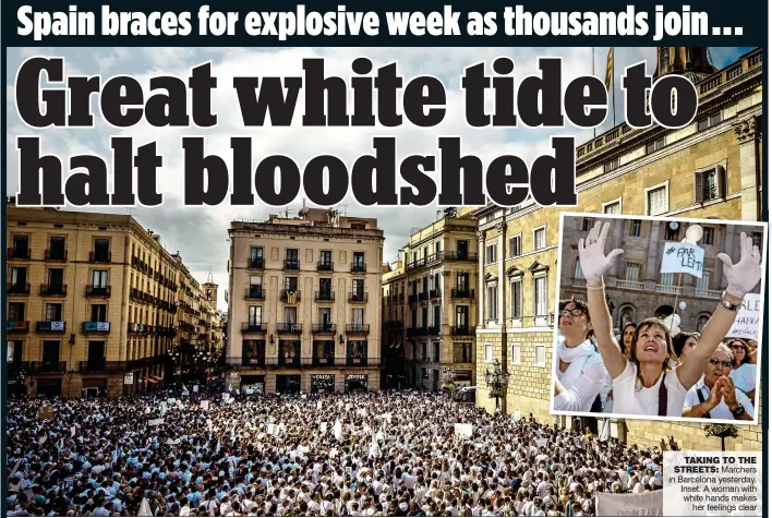  ??  ?? TAKING TO THE STREETS: Marchers in Barcelona yesterday. Inset: A woman with white hands makes her feelings clear