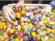  ??  ?? Arnold Gold / Hearst Connecticu­t Media Above, children sift through a tub of ducks at Essex Duck on National Rubber Ducky Day, Jan. 13. At left, Mykenzie Parker, 12, of Ivoryton, holds a Donald Trump rubber duck at Essex Duck, a quirky store that sells...