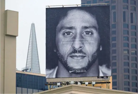  ?? ERIC RISBERG/AP ?? A billboard in San Francisco promotes Colin Kaepernick’s Nike ad campaign.