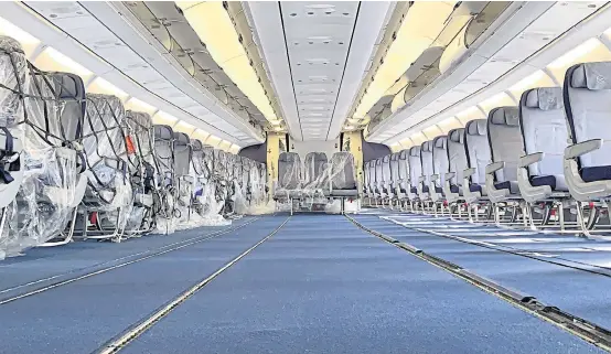  ?? DEUTSCHE LUFTHANSA AG VIA REUTERS ?? A handout picture shows the interior of a passenger plane which is modified as temporary freighter.